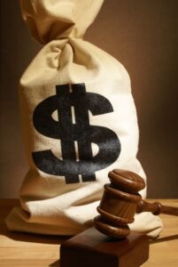 A gavel and a bag of money symbolize various legal expenses.